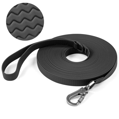 Black dog leash with textured handle and metal clip on a white background