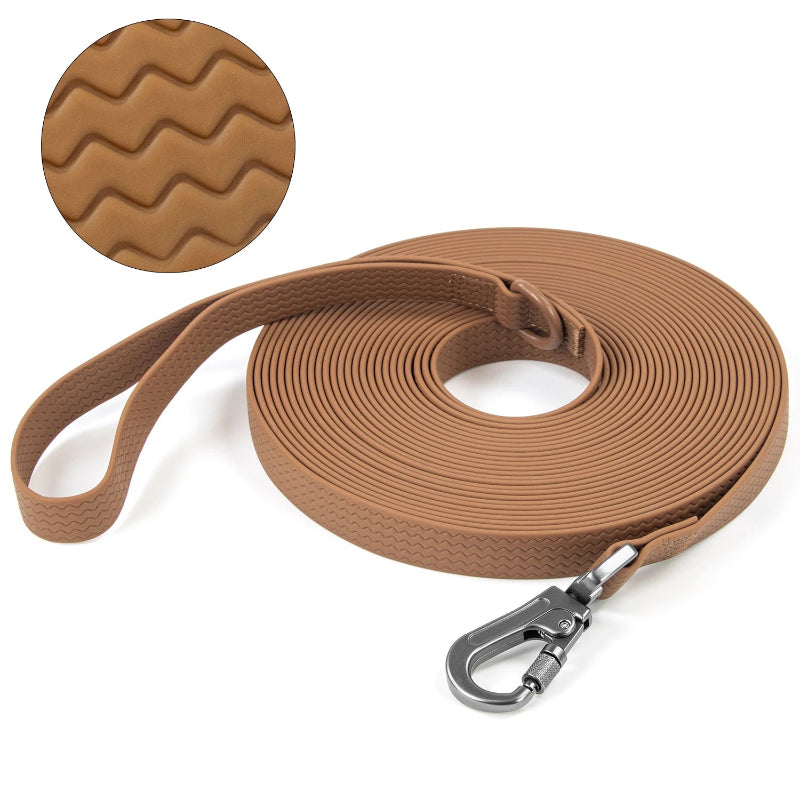 Brown dog leash with textured handle and metal clip on a white background