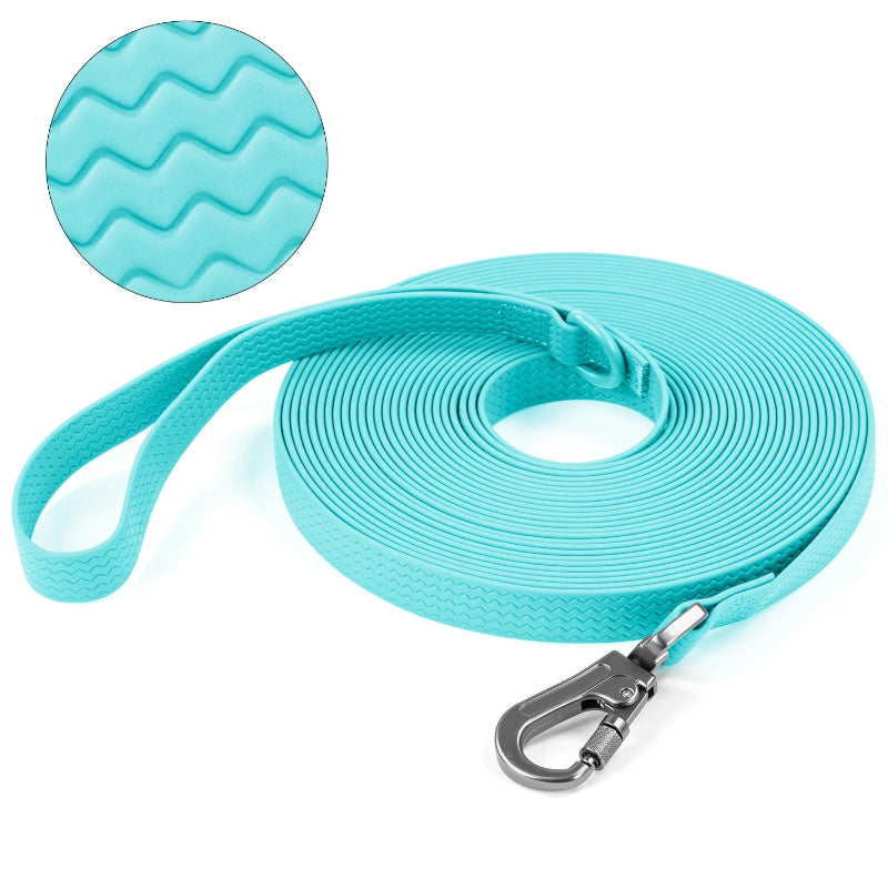 Green dog leash with textured handle and metal clip on a white background